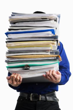 Man holding stack of paperwork regarding Alberta lawyers expecting a plethora of lawsuits post-pandemic COVID-19