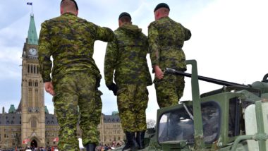Canadian armed forces soldiers saluting regarding the sexual misconduct class action lawsuit settlement