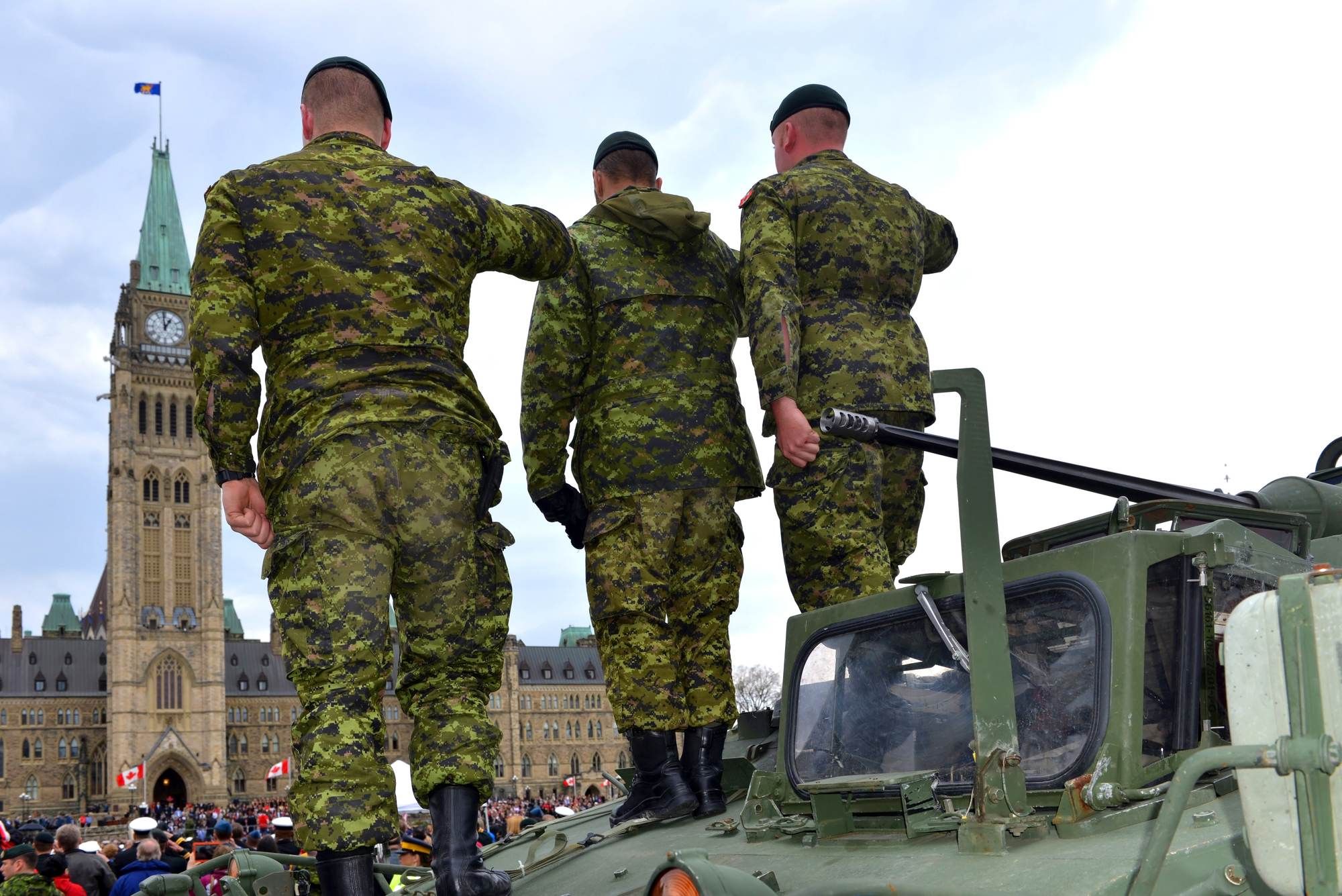 Canadian armed forces soldiers saluting regarding the sexual misconduct class action lawsuit settlement 