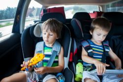 Children sitting in booster seat rgarding the Big Kid booster seat class action lawsuit filed