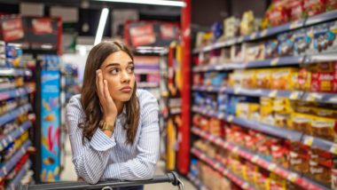 woman shopping amid mass product recalls in Canada