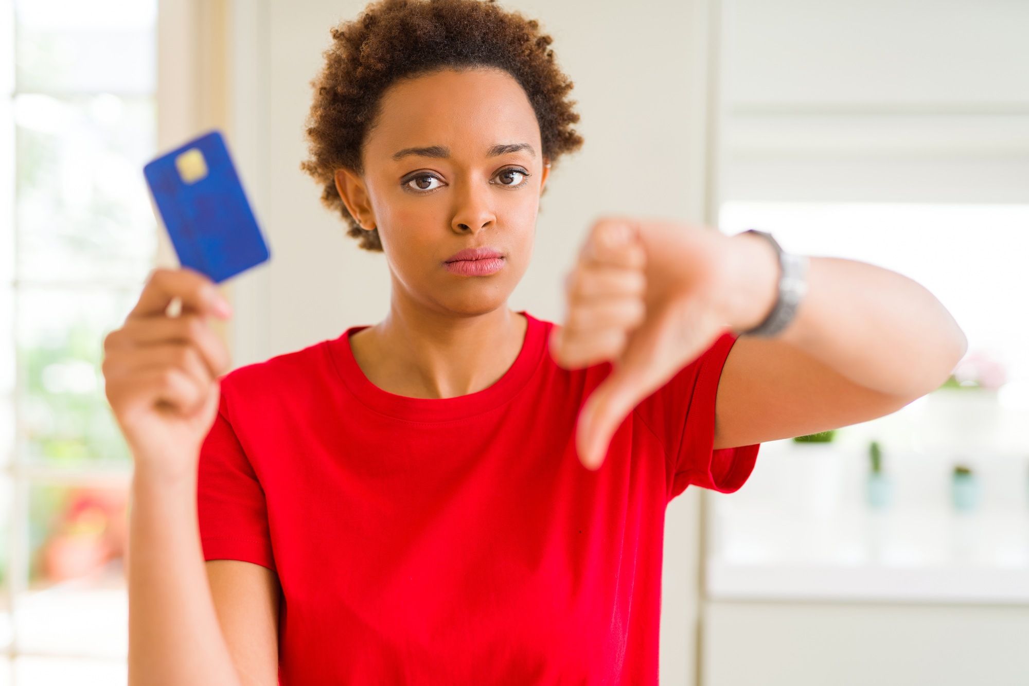 woman holding a card regarding the prepaid visa card settlement 