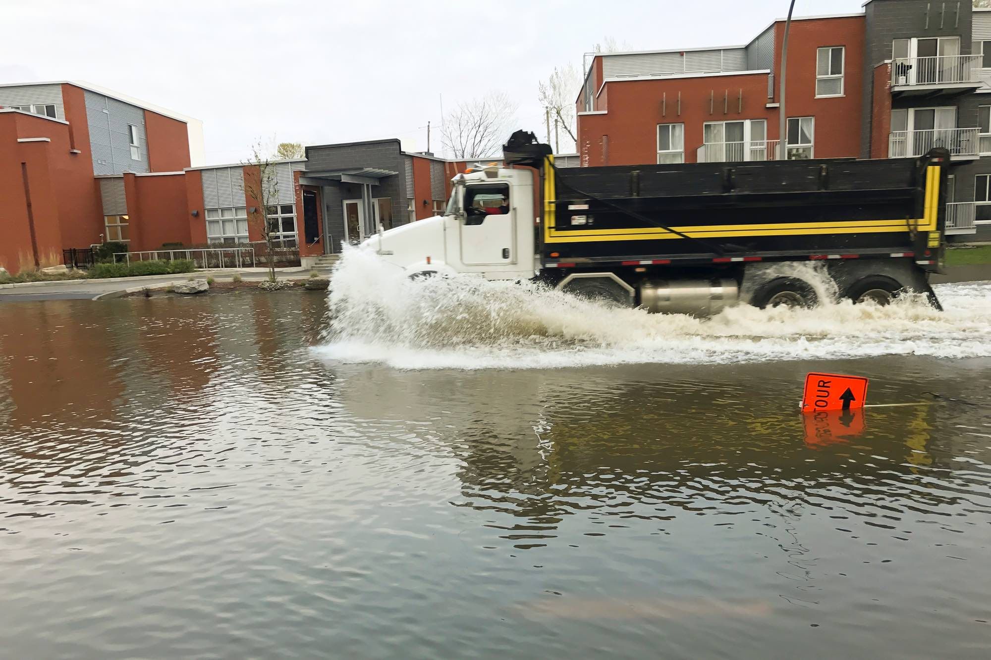 truck driving in flooded St Léonard now facing lawsuit