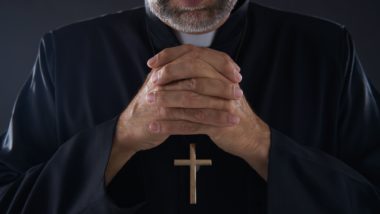 Cropped shot of a priest regarding the Archdiocese of Vancouver class action lawsuit