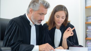 Quebec lawyers reading civil code of Québec amendments on sexual assault statute of limitations