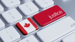 Laptop justice and Canadian flag button