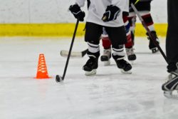 kids skating on hockey rink with coach accused of abuse