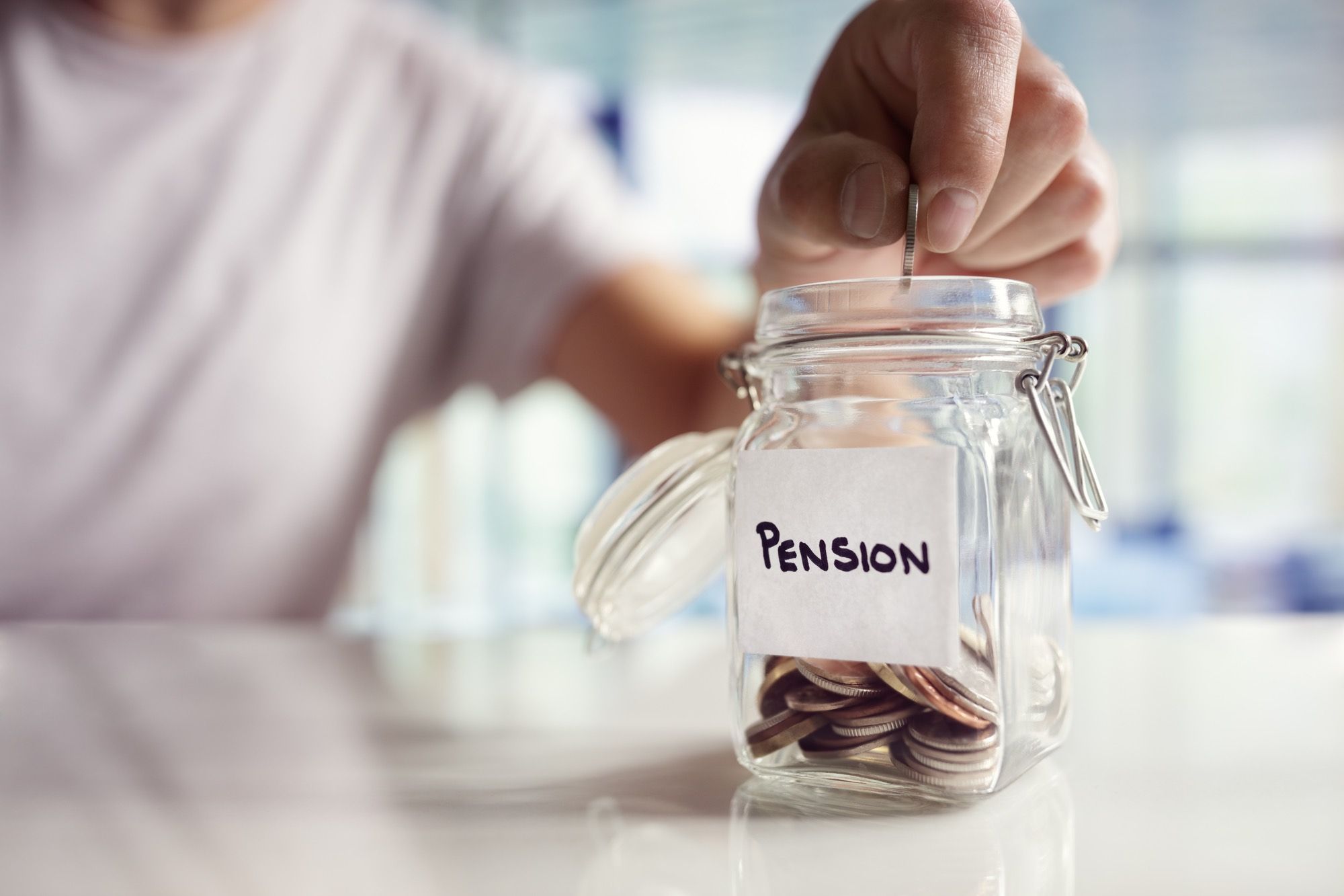 Putting coins in pension jar amid pension plan changes