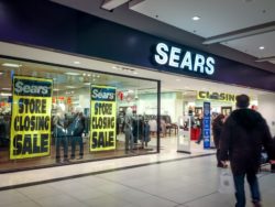 Sears closing signs regarding the Sears Canada settlement 