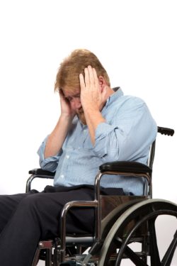 Upset man in a wheelchair regarding the MDC class action lawsuit alleging abuse 
