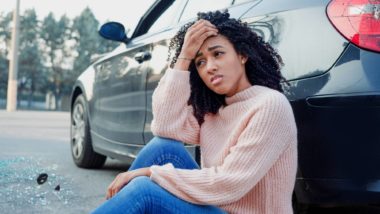 Woman having car trouble regarding the Fiat Chrysler Automobile class action lawsuit filed