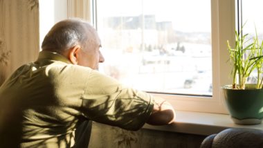 long-term care resident looking out window