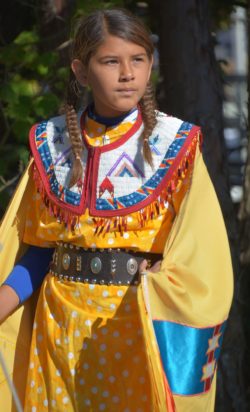 Little girl in Indigenous attire regarding the Samson Cree lawsuit notifying class members