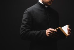 priest reading bible 
