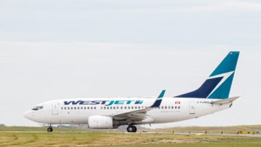 WestJet Airlines C-FUWS Boeing 737-700 about to take off from Calgary International Airport