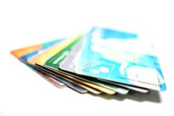 A fanned-out stack of debit or credit cards - NSF fee