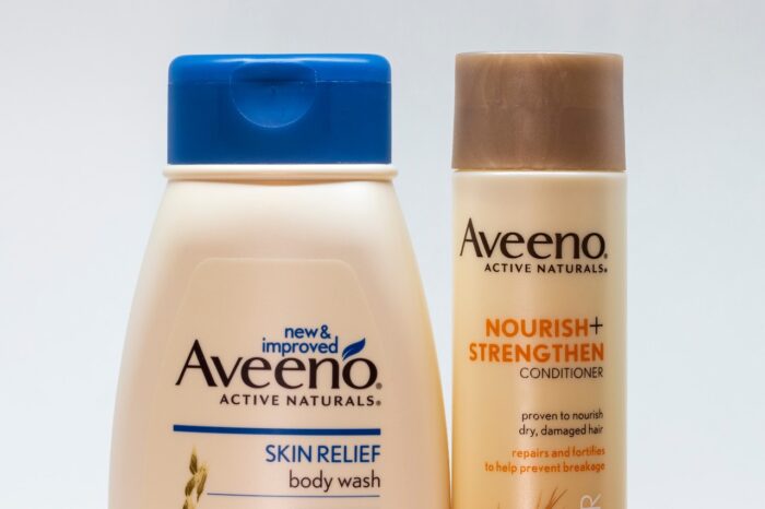 Two Aveeno Active Naturals products are shown - Aveeno Active Naturals settlement - aveeno class action