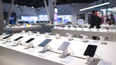 Showcase with smartphones in the modern electronics store
