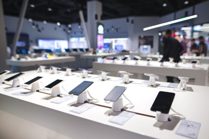Showcase with smartphones in the modern electronics store