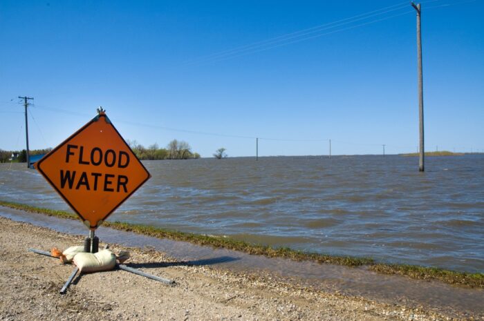 A sign warns of flood waters near Rapid City, Manitoba.