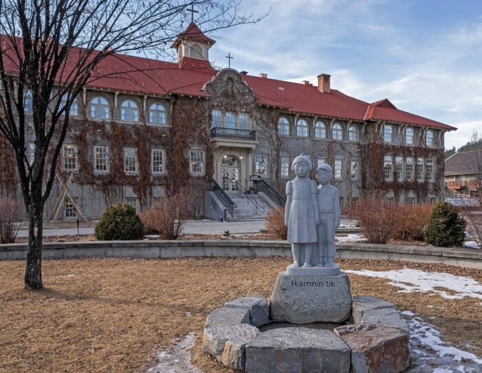 Exterior view of the Saint Eugene Mission school, formally an aboriginal residential school, now a hotel on the Ktunaxa Nation - day scholars settlement - indian residential schools - day scholars class action