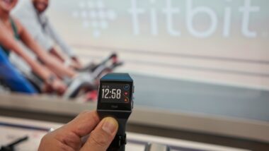 A shopper takes a closer look at a Fitbit Ionic Smartwatch in a Best Buy store in Vancouver.
