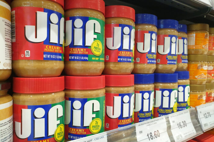 JIF brand peanut butter spread on store shelf in grocery store.