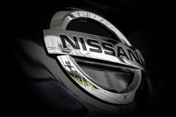 closeup logo nissan car with soft-focus and over light in the background - nissan cvt settlement