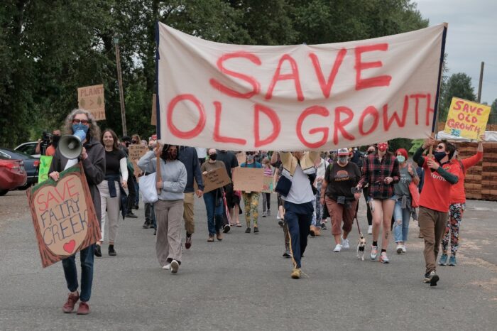 Surrey, BC, Canada - May 30, 2021: Activists march in protest against old growth logging in Fairy Creek at the Teal Jones Group sawmill and HQ