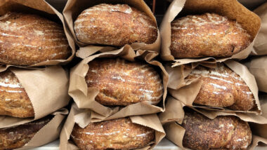 Close up of fresh baked bread, representing the Canada Bread Co. price-fixing fine.