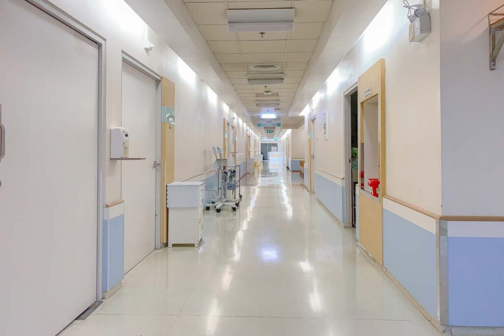 Interior of a hospital corridor, representing the Restigouche Hospital Centre settlement.