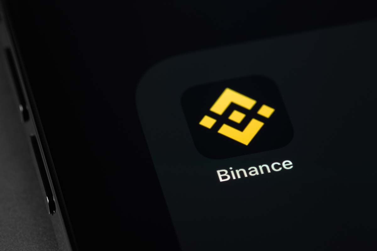 Close up of Binance app icon displayed on a smartphone screen, representing the Binance fine.