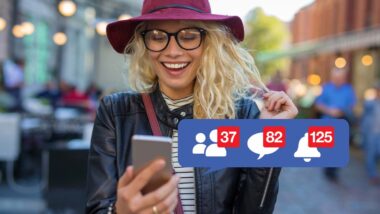 A woman smiling at her phone with a Facebook notifications overlay, representing the Facebook Sponsored Stories settlement.