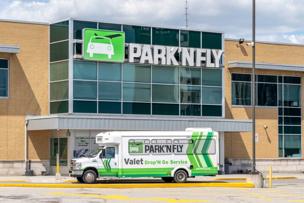 A shuttle bus in front of Park'N Fly building, representing the Park'N Fly data breach.