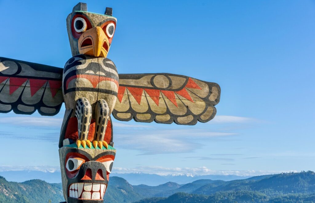 A First Nations totem pole welcomes travellers at the summit of the Malahat section of the Trans Canada highway near Victoria BC