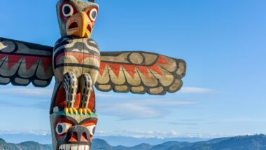 A First Nations totem pole welcomes travellers at the summit of the Malahat section of the Trans Canada highway near Victoria BC