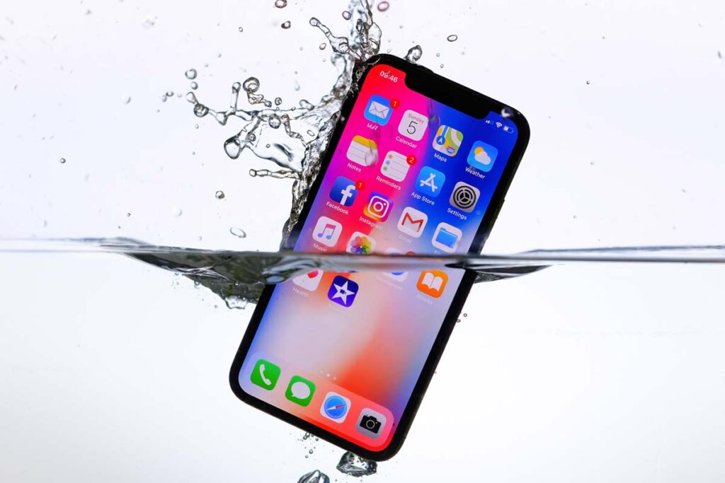 Close up of iPhone submerged in water, representing the Apple class action.